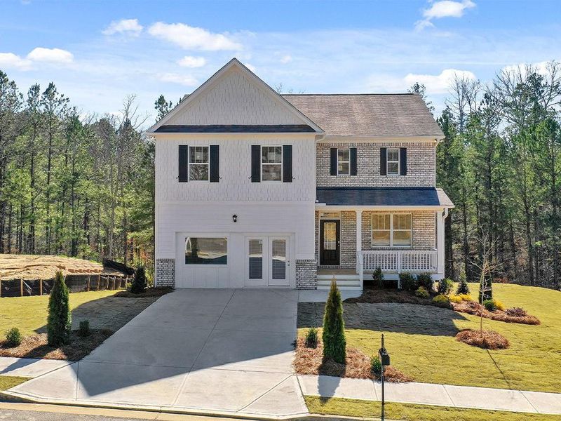 Front exterior of a new home in Lost Creek, Dallas, GA, highlighting curb appeal (Image 20). Front exterior of a new home in Lost Creek, Dallas, GA, highlighting curb appeal (Image 20).