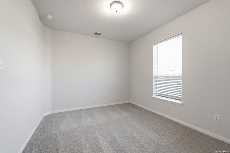 Spacious, unfurnished interior of a new home in The Woodlands at Medina Hills, Mico (Image 25).