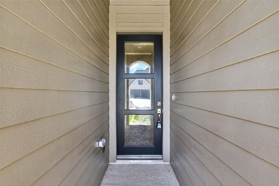 Exterior details and patio area of a home in Harvest Green 45', Richmond (Image 26).