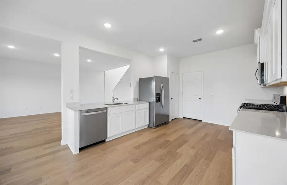 *Floorplan representation, not actual home - Large island overlooking gathering room and dining areas
