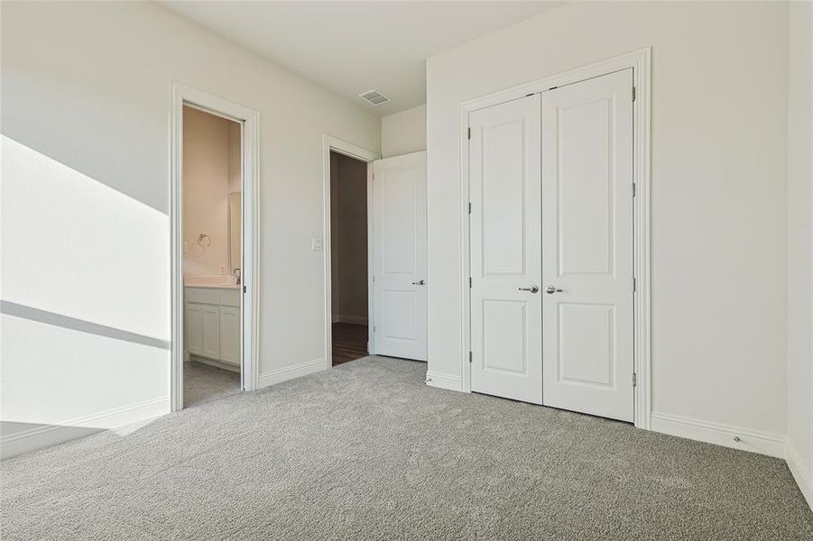 Bathroom featuring vanity, bathtub / shower combination, and light tile patterned floors Bathroom featuring vanity, bathtub / shower combination, and light tile patterned floors