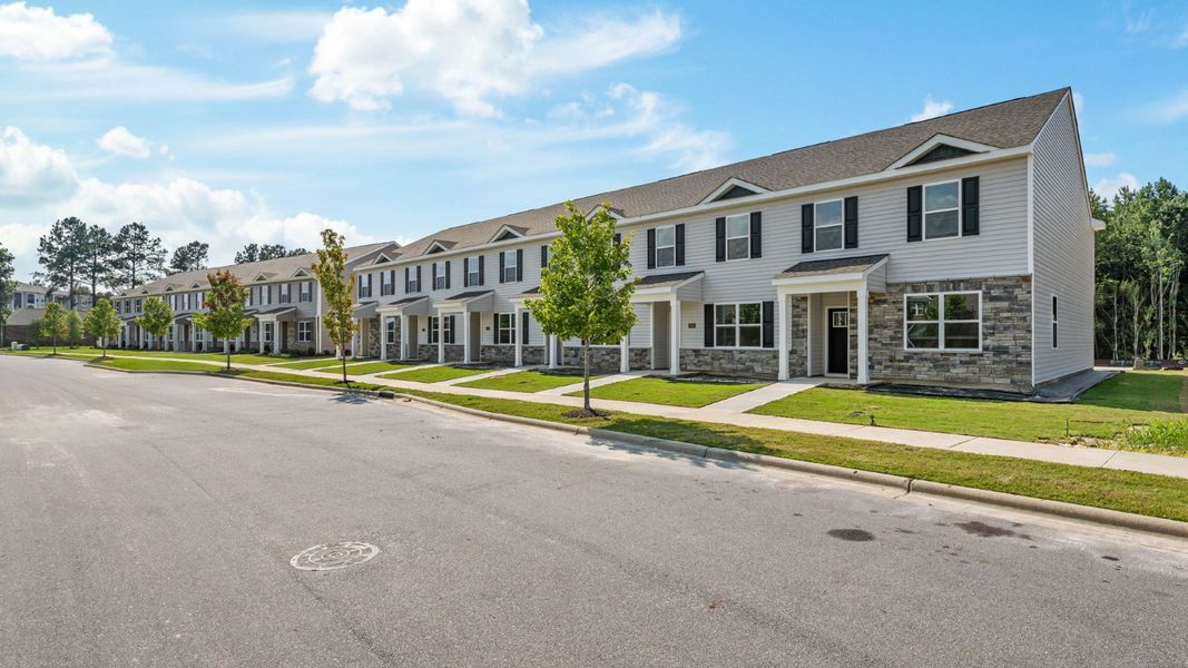 Front exterior of a new home in Clock Road Townhomes, New Bern, NC, highlighting curb appeal (Image 15).