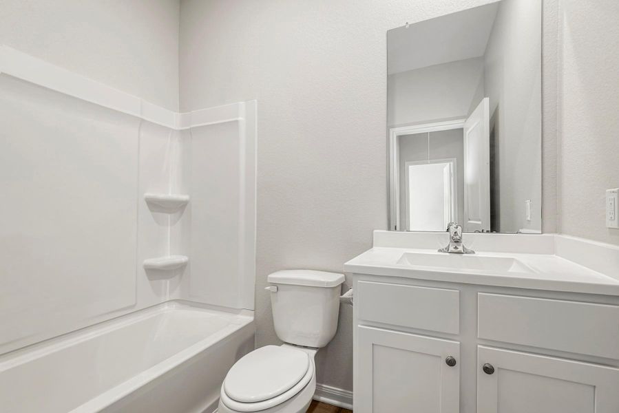 Secondary Bathroom comes with a shower and tub combo.