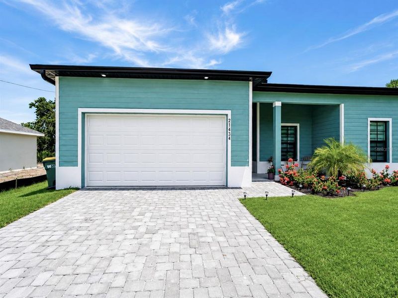 Front exterior of a new home in , Port Charlotte, FL, highlighting curb appeal (Image 23).