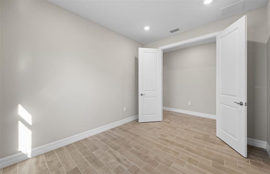 Spacious, unfurnished interior of a new home in Cedar Grove at The Woodlands, North Port (Image 27).