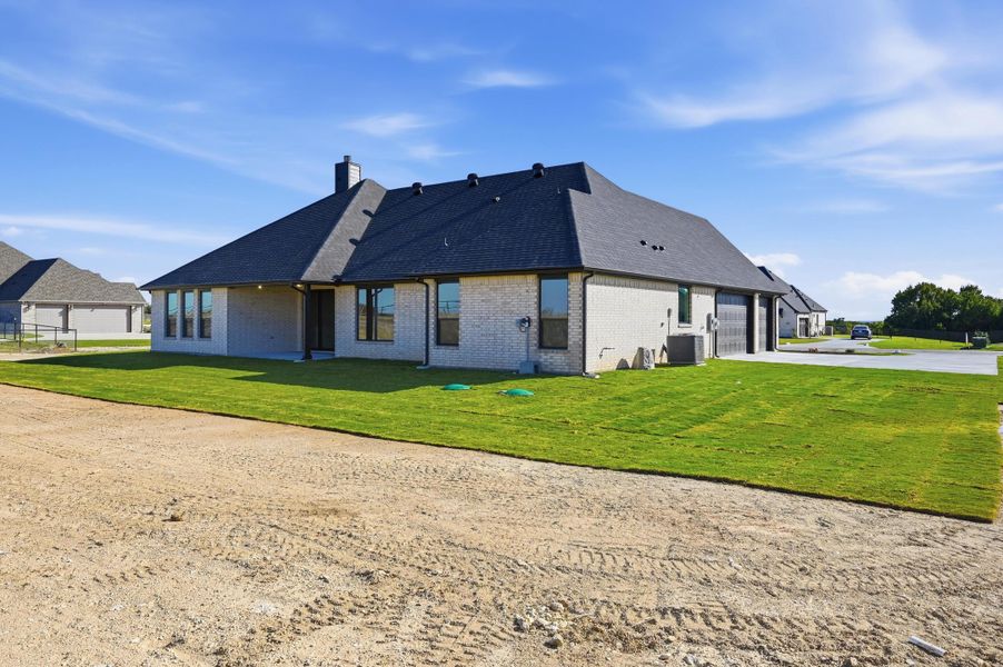 Front exterior of a new home in Rocky Top Ranch, Azle, TX, highlighting curb appeal (Image 23). Front exterior of a new home in Rocky Top Ranch, Azle, TX, highlighting curb appeal (Image 23).