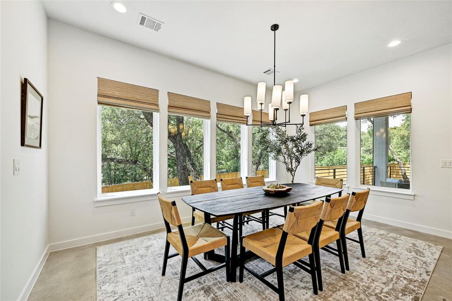 Light-filled dining area with backyard views from two walls, large enough to comfortably seat 8+. Light-filled dining area with backyard views from two walls, large enough to comfortably seat 8+.