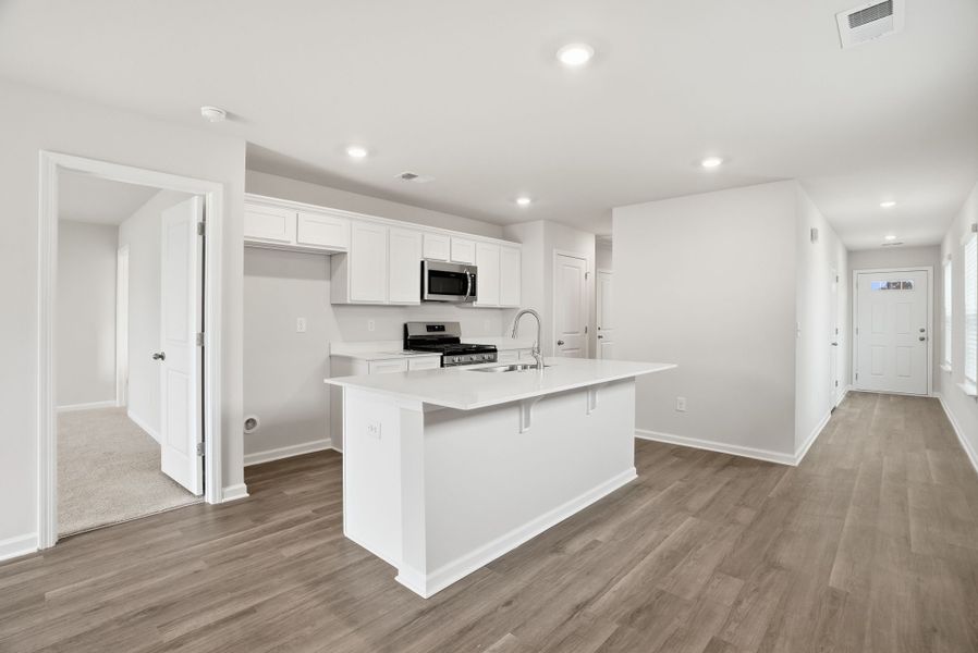 Representative furnished interior of a home built from the Juniper B by McGuinn Homes in Hunters Branch, Hopkins (Image 16).