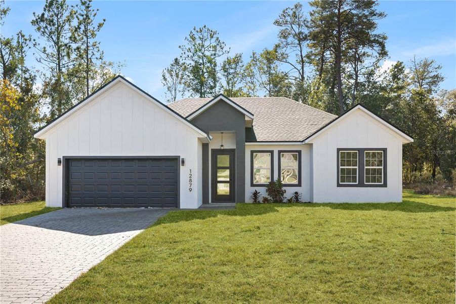 Front exterior of a new home in , Ocala, FL, highlighting curb appeal (Image 24).