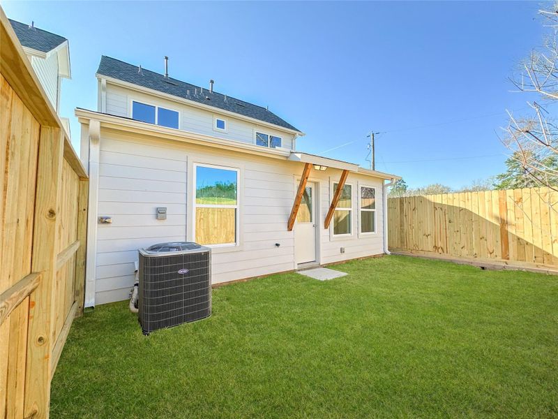 Exterior details and patio area of a home in , Conroe (Image 3).
