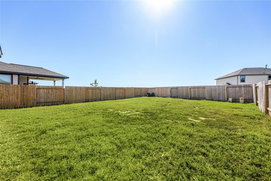 A generous backyard offering endless possibilities, from creating your dream garden to adding a play area or outdoor living space. The wide, fenced lot provides both privacy and plenty of room to enjoy the outdoors in comfort. A generous backyard offering endless possibilities, from creating your dream garden to adding a play area or outdoor living space. The wide, fenced lot provides both privacy and plenty of room to enjoy the outdoors in comfort.