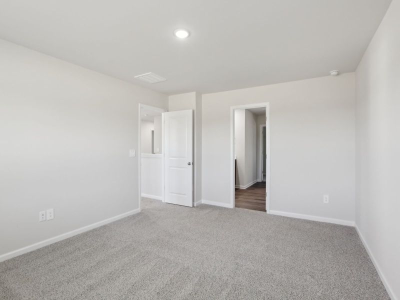 Primary bedroom in the Dakota floorplan at 199 White Birch Lane.