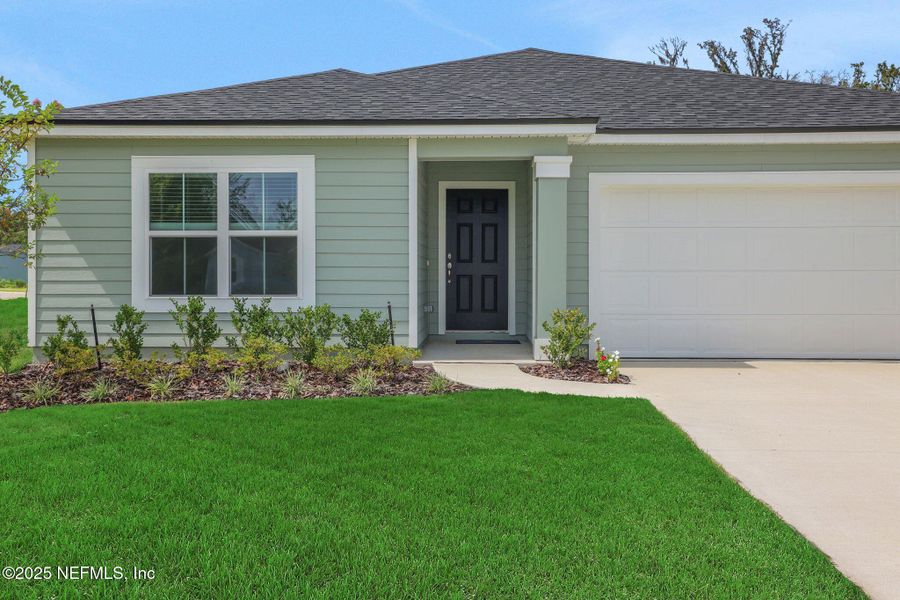 Front exterior of a new home in Wilford Oaks, Orange Park, FL, highlighting curb appeal (Image 17). Front exterior of a new home in Wilford Oaks, Orange Park, FL, highlighting curb appeal (Image 17).