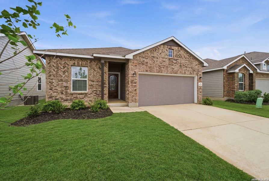 Front exterior of a new home in Hennersby Hollow, San Antonio, TX, highlighting curb appeal (Image 16).
