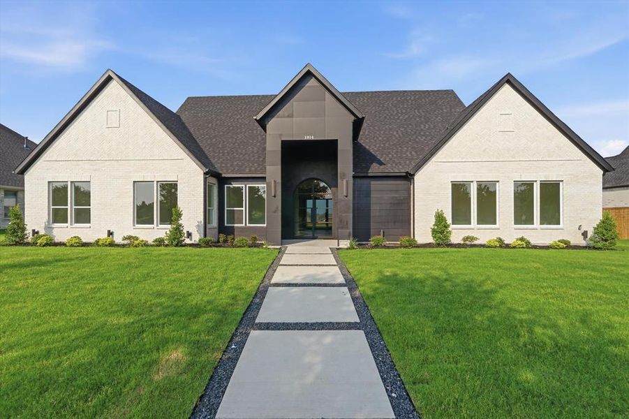 Front exterior of a new home in , Forney, TX, highlighting curb appeal (Image 1). Front exterior of a new home in , Forney, TX, highlighting curb appeal (Image 1).
