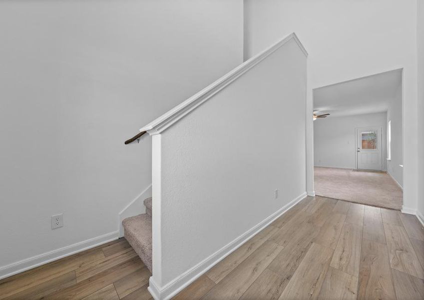 The long foyer leads to the main living area