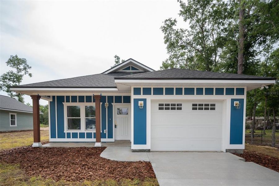 Front exterior of a new home in , Williston, FL, highlighting curb appeal (Image 1).