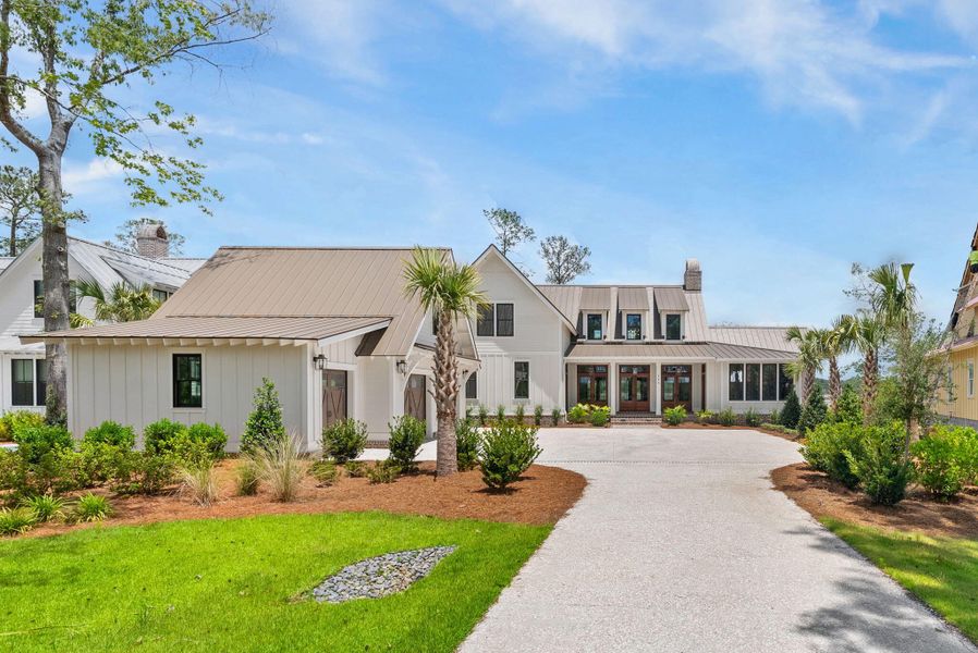 Front exterior of a new home in , Ravenel, SC, highlighting curb appeal (Image 14).
