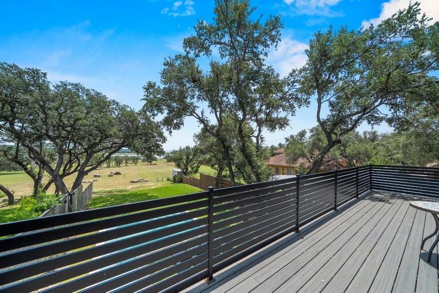 The oversized second-story balcony offers a front-row seat to sweeping Canyon Lake views, providing the perfect setting for morning coffee or unforgettable sunset evenings. The oversized second-story balcony offers a front-row seat to sweeping Canyon Lake views, providing the perfect setting for morning coffee or unforgettable sunset evenings.