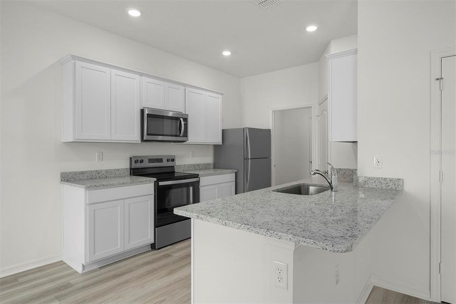 Furnished interior view inside a new home in Tula Parc, Astatula (Image 7).