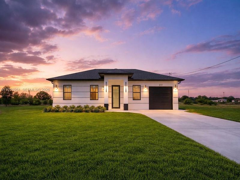 Front exterior of a new home in , Lehigh Acres, FL, highlighting curb appeal (Image 1). Front exterior of a new home in , Lehigh Acres, FL, highlighting curb appeal (Image 1).