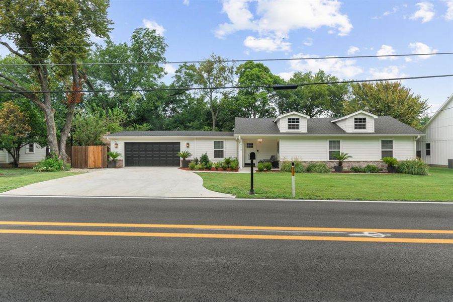 View of front of house with concrete driveway, a garage, covered porch, and a shingled roof View of front of house with concrete driveway, a garage, covered porch, and a shingled roof