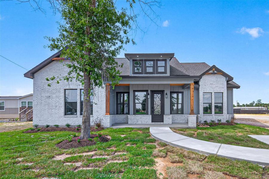 Front exterior of a new home in , Huffman, TX, highlighting curb appeal (Image 25). Front exterior of a new home in , Huffman, TX, highlighting curb appeal (Image 25).