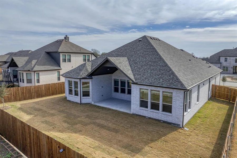 Exterior details and patio area of a home in Estates At Baker Park, Sherman (Image 24).