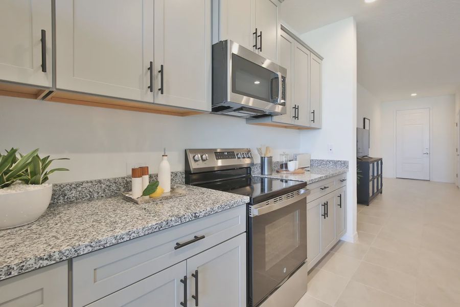 Representative furnished interior of a home built from the Morgan by Neal Communities in SkySail, Naples (Image 21).