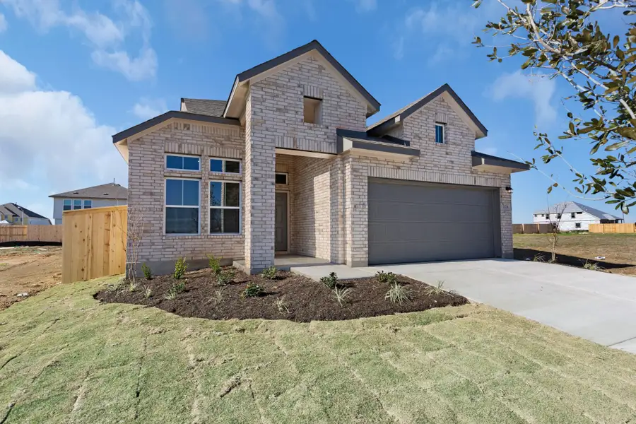 Front exterior of a new home in Briarwood, Elgin, TX, highlighting curb appeal (Image 1). Front exterior of a new home in Briarwood, Elgin, TX, highlighting curb appeal (Image 1).