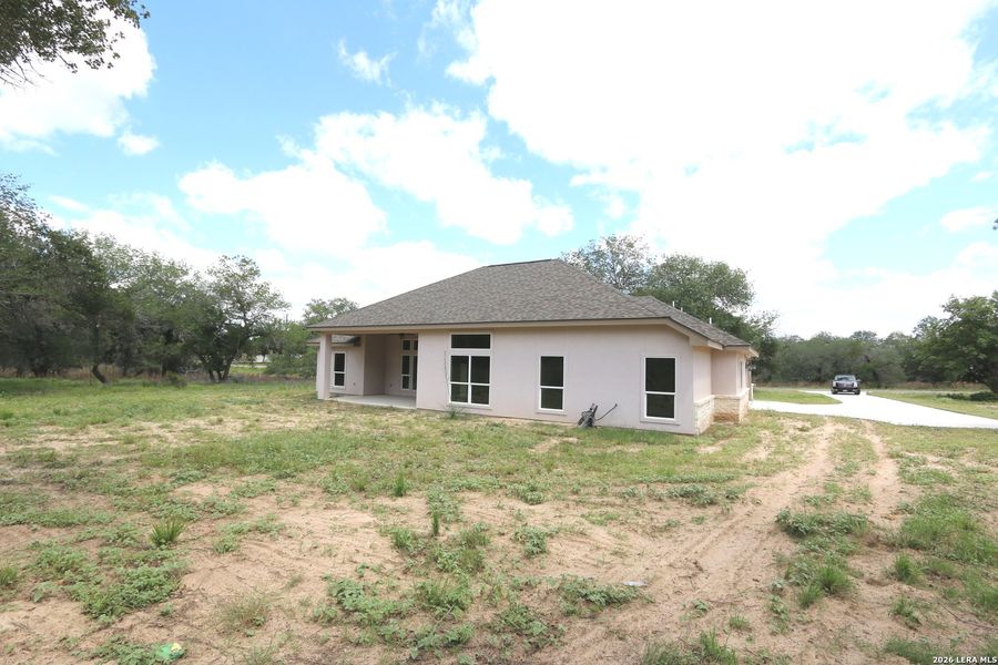 Exterior details and patio area of a home in , Floresville (Image 32).