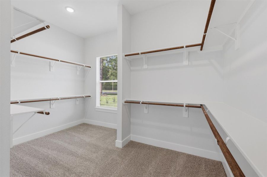 This closet might as well be another bedroom! Imagine getting ready for the day here every day!