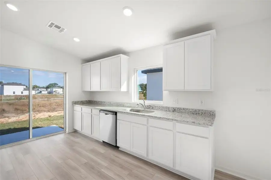 Furnished interior view inside a new home in Tula Parc, Astatula (Image 7).