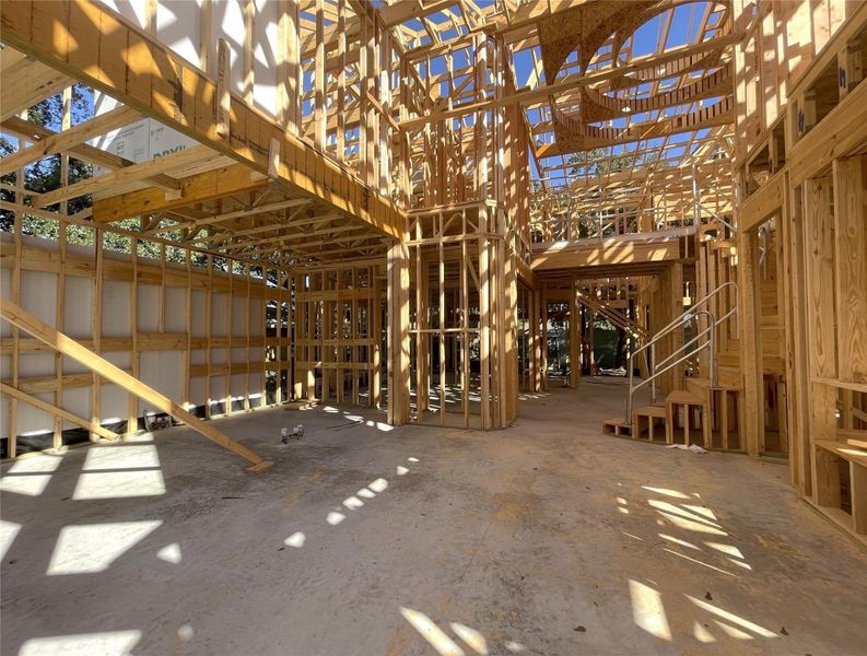 Open-Concept Kitchen Flowing Seamlessly Into the Living Area. Construction Photo as of 8-17-2026