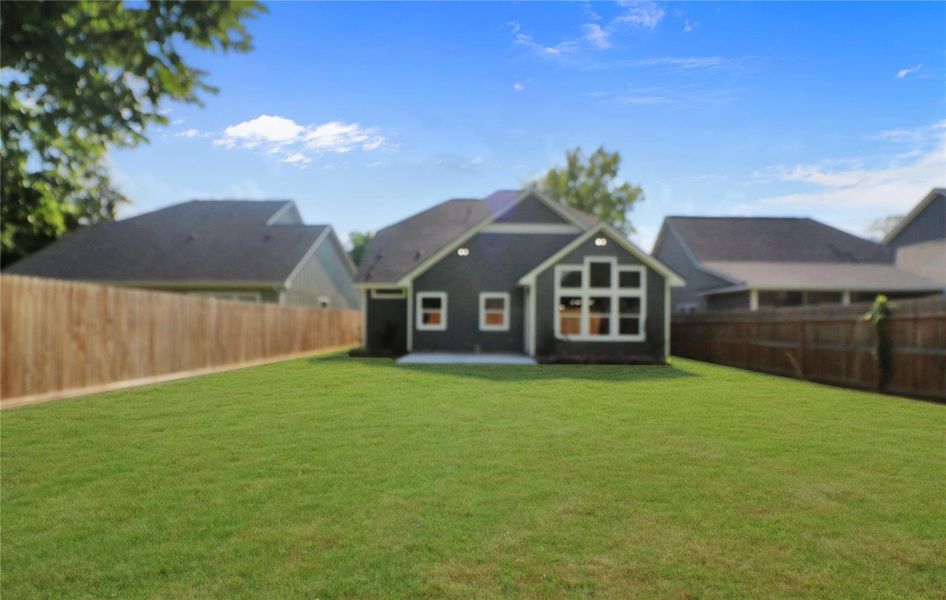 Fully fenced and sodded back yard. Fully fenced and sodded back yard.