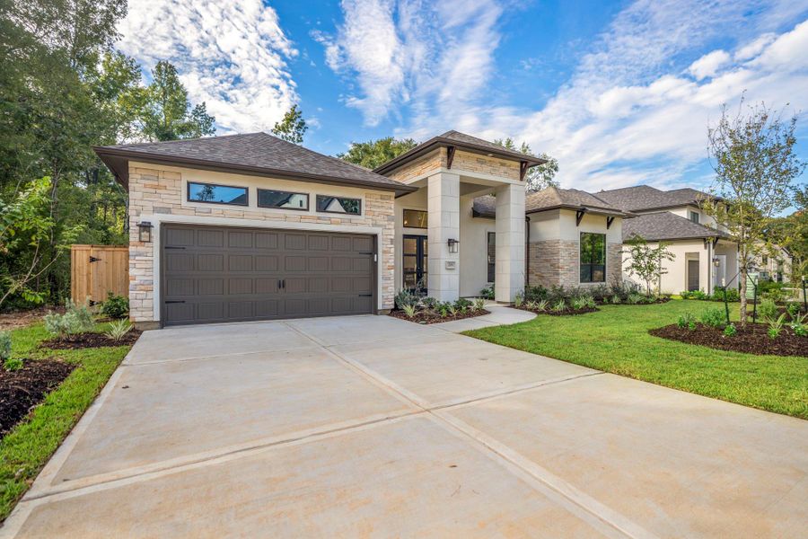 Front exterior of a new home in The Woodlands Hills, Willis, TX, highlighting curb appeal (Image 29). Front exterior of a new home in The Woodlands Hills, Willis, TX, highlighting curb appeal (Image 29).