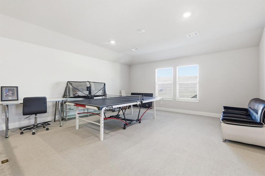 Rec room with light carpet, recessed lighting, and an office area