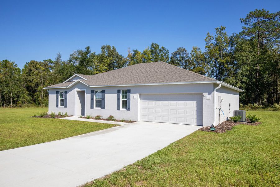 Front exterior of a new home in Marion Oaks, Ocala, FL, highlighting curb appeal (Image 2). Front exterior of a new home in Marion Oaks, Ocala, FL, highlighting curb appeal (Image 2).