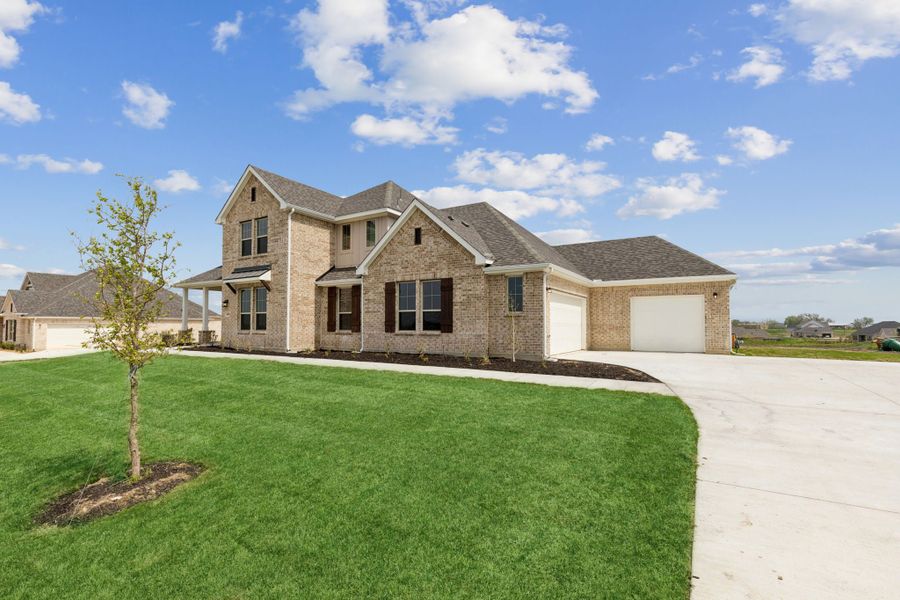 Representative exterior photo of a completed home built from the Yukon by Centre Living Homes in Ellis Ranch Estates, Waxahachie, TX (Image 21). Representative exterior photo of a completed home built from the Yukon by Centre Living Homes in Ellis Ranch Estates, Waxahachie, TX (Image 21).
