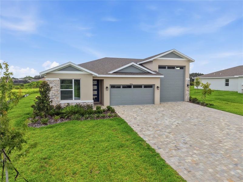 Front exterior of a new home in Glen Lakes, Weeki Wachee, FL, highlighting curb appeal (Image 2). Front exterior of a new home in Glen Lakes, Weeki Wachee, FL, highlighting curb appeal (Image 2).