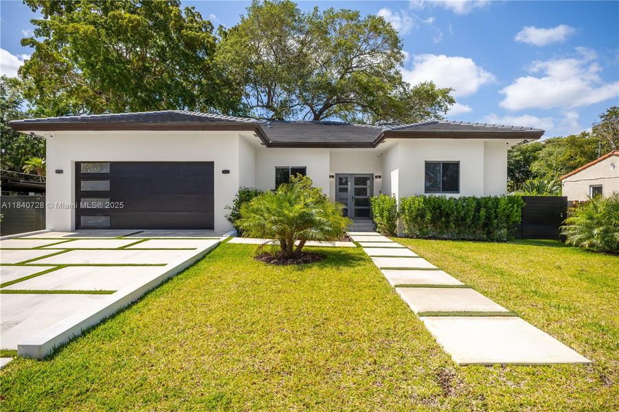 Front exterior of a new home in , Biscayne Park, FL, highlighting curb appeal (Image 24).