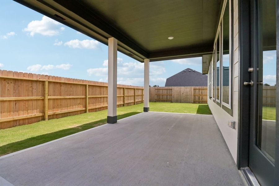 Exterior details and patio area of a home in Trinity Grove, Spring (Image 17).
