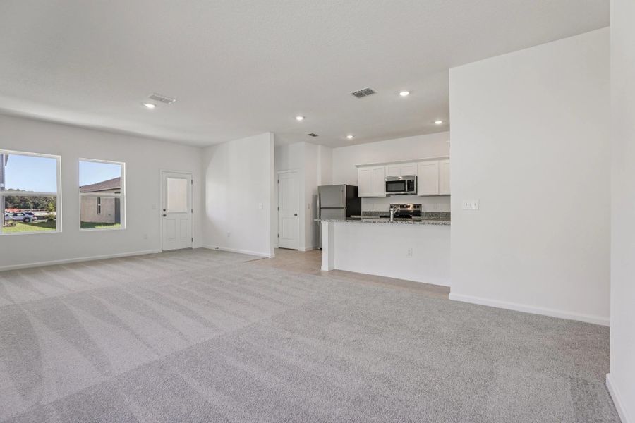Representative unfurnished interior of a home built from the Halo by Starlight Homes in Hawks Run, Kissimmee (Image 15).