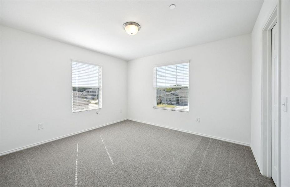 Spacious Bedroom with large windows
