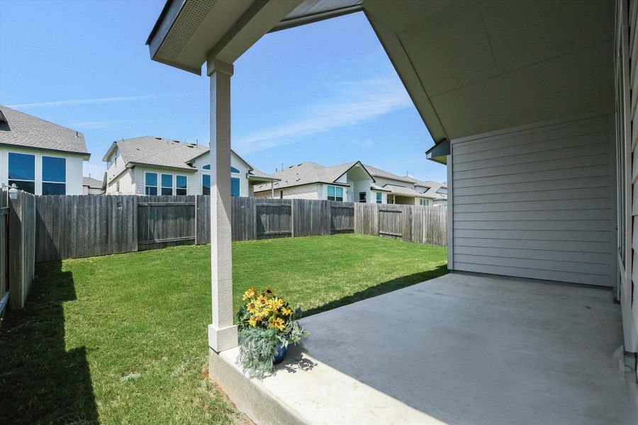 Covered patio with view of backyard.  A blank slate for the avid landscaper.