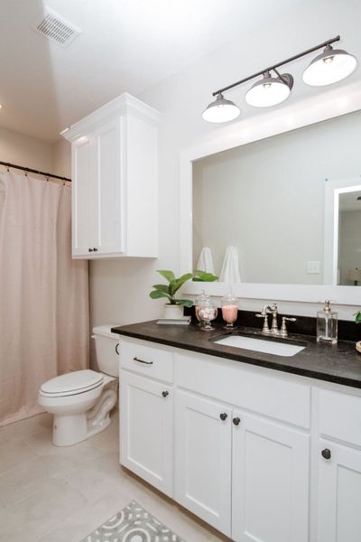 Representative furnished interior of a home built from the The Caroline by Reece Homes in Pebble Creek, College Station (Image 6).