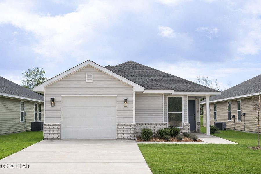 Front exterior of a new home in Fox Glenn, Panama City, FL, highlighting curb appeal (Image 2). Front exterior of a new home in Fox Glenn, Panama City, FL, highlighting curb appeal (Image 2).
