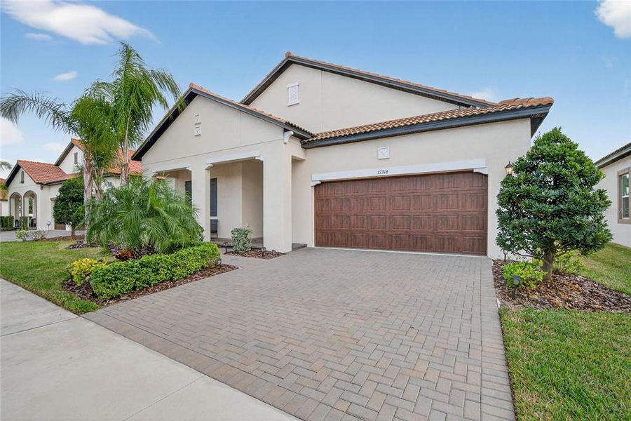 Front exterior of a new home in Southshore Bay: The Estates, Wimauma, FL, highlighting curb appeal (Image 22).