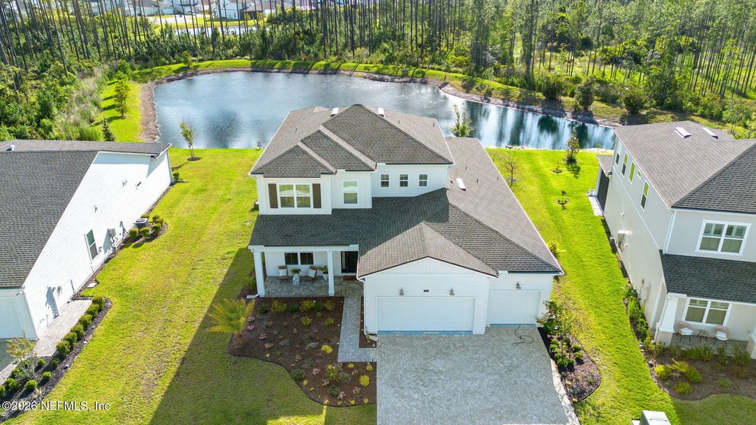 Front exterior of a new home in , St. Johns, FL, highlighting curb appeal (Image 2). Front exterior of a new home in , St. Johns, FL, highlighting curb appeal (Image 2).