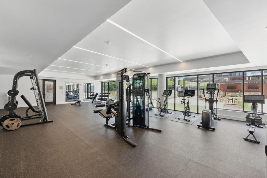 Fitness enthusiasts will appreciate the well-appointed gym, offering an array of equipment and ample natural light.